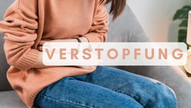 Person, die sich vor Schmerzen an den Bauch greift